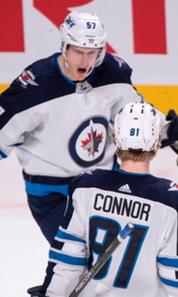 Jets reach 50 wins with 5-4 OT triumph over Canadiens